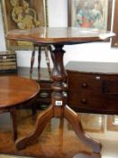 A Victorian mahogany tripod tip up side table