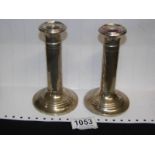 A pair of hall marked silver candlesticks