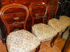 A set of 4 Victorian balloon back chairs