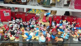 A quantity of Disney figures inc.