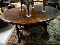 A large oval walnut veneered side table