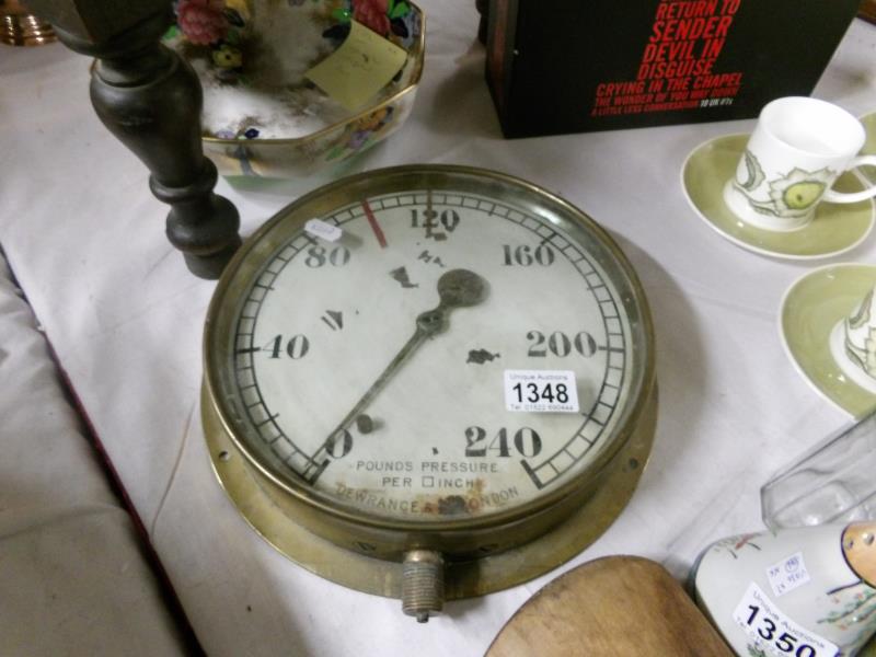 A brass pressure gauge