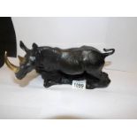 A bronze figure of a Rhino with gilded horns