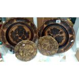 2 wooden chargers with floral decoration and 2 others