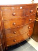 A Victorian bow fronted chest of drawers