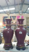 A pair of red brick glazed porcelain table lamps