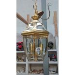 A good quality brass lantern with bevelled glass