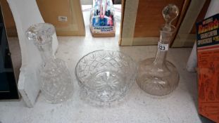 2 glass decanters and a bowl