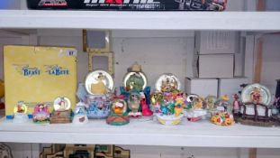 A collection of Disney snow globes