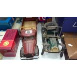 A vintage style tinplate vintage car and American lorry