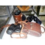 4 pairs of vintage binoculars and a gunsight