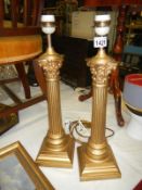 Pair of impressive gilded Corinthian column table lamps