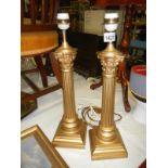 Pair of impressive gilded Corinthian column table lamps