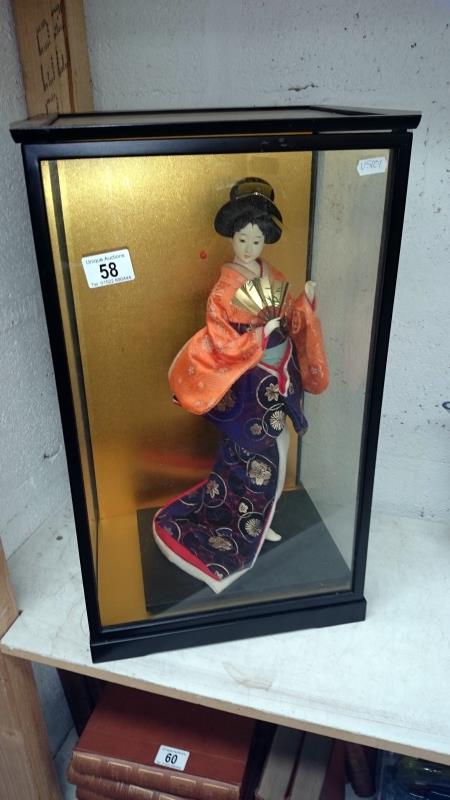A cased Japanese 'Geisha' doll