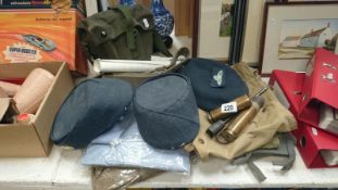 A quantity of old military uniform etc.