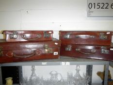 4 leather suitcases