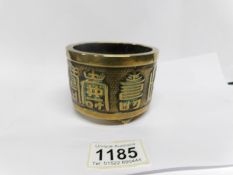 A 19th century Oriental brass pot with Chinese symbols