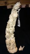 A tall carved ivory group,