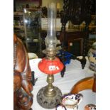 Oil lamp with red glass vessel