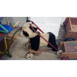 A childrens vintage push along/walker panda