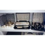 A mixed lot of silver plate including place mats, napkin rings & cased cutlery etc.