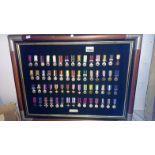 A display of 60 military miniature medals from battle campaigns and gallantry