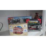 4 Boxed Corgi models inc. bus, trolley bus etc.