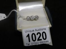 An 18ct gold ring set 3 'flowerhead' diamonds