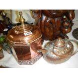 A copper kettle and a copper dome