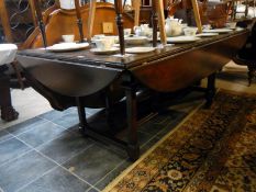 Large inlaid oak dining table with drop leaves