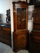 A Burr elm veneered corner cupboard with astragal glazed top