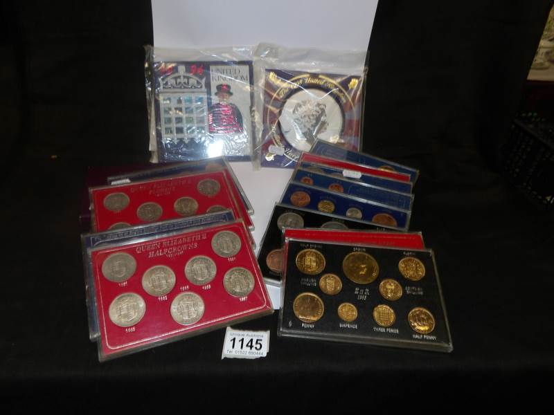 A quantity of British commemorative coin sets