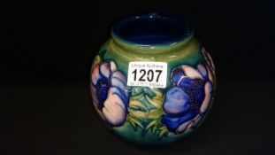 Moorcroft floral vase with blue and green background (chip to base)