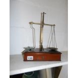A set of small Victorian apothecary scales with weights