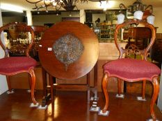 A tilt top side table with carved top A/F & a pair of chairs