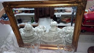 A gilt framed bevel edged mirror