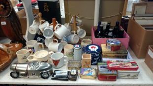 A quantity of mugs depicting aircraft, 10 aviation beer bottles,