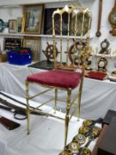 A gold coloured brass chair