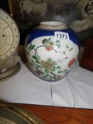 A fine hand painted ginger jar in deep blue,