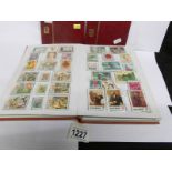 An album of Vietnam stamps together with 2 small albums of mainly mint Hong Kong,