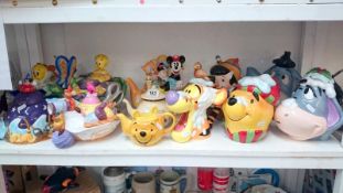 A quantity of Disney teapots