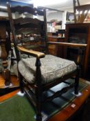 An oak carver ladder back chair