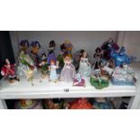 A collection of Disney figurines from Aladdin, Pocahontas,