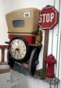 A decorative wall clock in the shape of the back of a vintage car