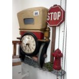 A decorative wall clock in the shape of the back of a vintage car