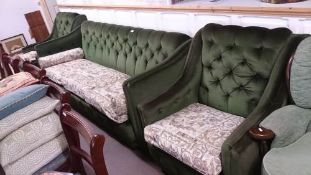 A green 3 piece deep buttoned suite