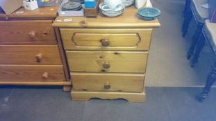 A 3 drawer pine chest of drawers