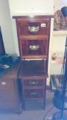A pair of inlaid 2 drawer chests
