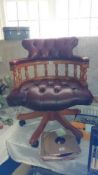 A deep buttoned captains chair