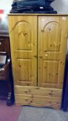 A 2 door pine wardrobe